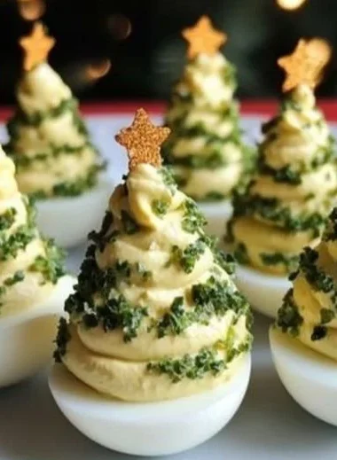 Festive deviled egg Christmas trees arranged on a platter