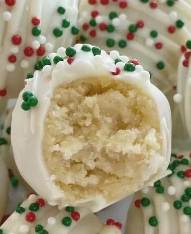 Delicious sugar cookie truffles decorated with festive sprinkles