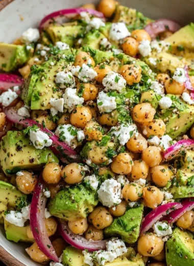 Chickpea Feta Avocado Salad with colorful vegetables in a bowl