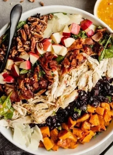 A vibrant Fall Harvest Salad with seasonal ingredients and colorful toppings