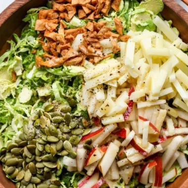 Shaved Brussels and Pear Salad, featuring fresh Brussels sprouts and juicy pears.