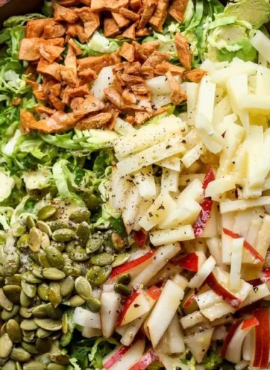 Shaved Brussels and Pear Salad, featuring fresh Brussels sprouts and juicy pears.