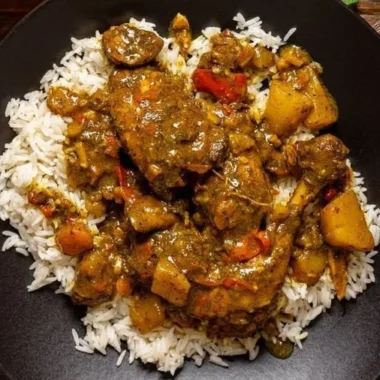 Authentic Jamaican Curry Chicken served in a traditional dish
