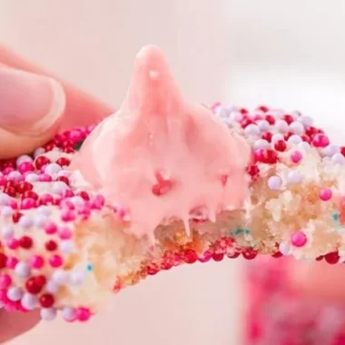 Delicious strawberry kiss cookies topped with a chocolate kiss