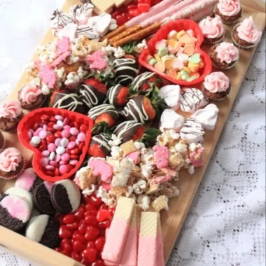 Valentine Dessert Charcuterie Board 2 Valentine dessert charcuterie board with assorted sweet treats and heart-shaped items