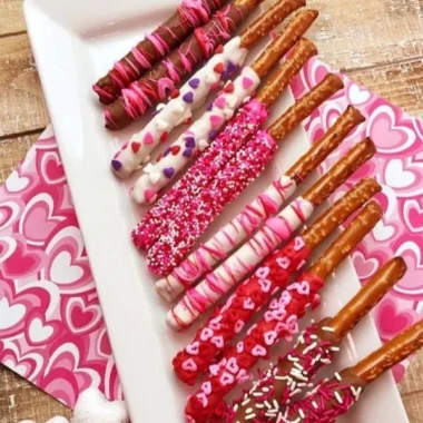 Valentine's Day Chocolate Dipped Pretzels 1 Valentine's Day chocolate dipped pretzels decorated with sprinkles