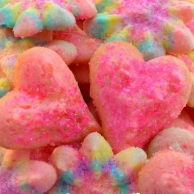 A variety of beautifully decorated Valentine's Day cookies in heart shapes.