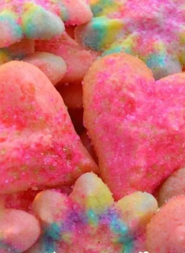 A variety of beautifully decorated Valentine's Day cookies in heart shapes.