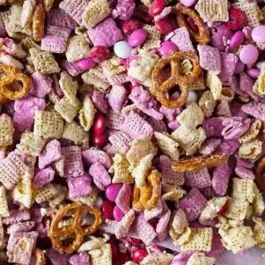 Valentine's Day Puppy Chow Chex Mix 2 Valentine's Day Puppy Chow Chex Mix filled with colorful candies and treats.