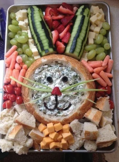 Colorful bunny veggie plate with fresh vegetables and healthy dips for kids