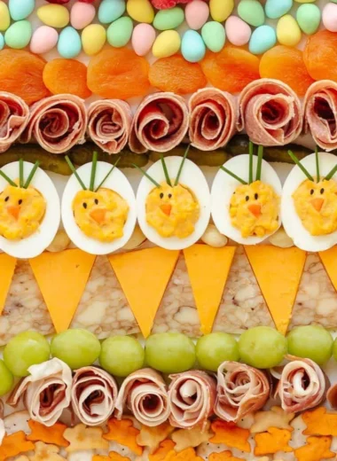 Colorful Easter Charcuterie board featuring spring-themed snacks and decorations